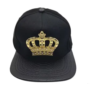 Black hip-hop snapback hat featuring a gold rhinestone crown emblem and PU leather flat brim.