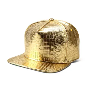 Close-up of golden crocodile pattern PU leather flat brim hip hop hat texture detail.