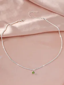 Elegant silver clavicle chain necklace featuring a sparkling green crystal pendant for women.