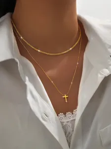 Layered gold cross necklace detail, sparkly chain choker aesthetic jewelry close up