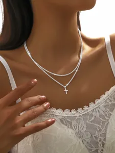 Stunning double layer glitter cross pendant necklace close-up, elegant clavicle chain detail view.