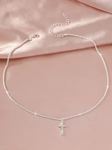 Sparkling silver cross pendant clavicle necklace, detailed look of elegant minimalist style.
