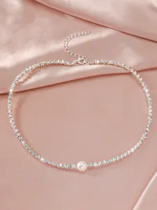 Elegant silver-tone chain necklace featuring a delicate central pearl pendant for women.