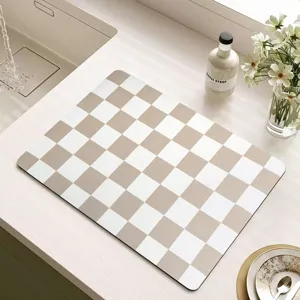 Checkered diatomaceous earth draining mat, absorbent kitchen table mat for coffee machine.