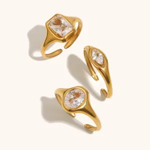 Detail view of chunky 18k gold plated stainless steel rings featuring elegant cubic zirconia.