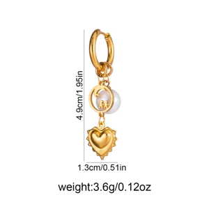 Gold long pendant earrings with pearl moon and heart charm, elegant fashion jewelry accessory.
