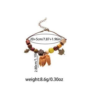Vintage bohemian handmade wooden bead bracelet with acorn leaf charms and dried flower pendant.