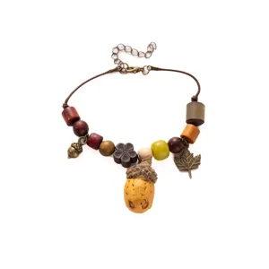 Vintage handmade wooden bead acorn charm bracelet detail view for boho women jewelry
