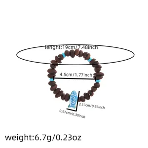 Coffee bean beaded bracelet with blue fish pendant, stylish fashion jewelry accessory for women.