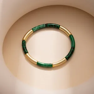 Exquisite leopard print and gold metal bamboo segment bracelet, retro geometric design detail.