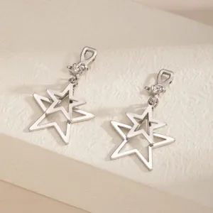 Silver tone double hollow star dangle clip on earrings detail view, minimalist jewelry design.