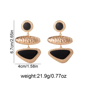 Retro geometric metal drop earrings with black enamel inlay, elegant long design for women.