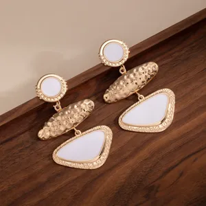 Retro geometric metal drop earrings with white enamel, elegant long fashion jewelry for women.