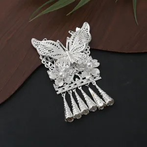Detailed close-up of the silver butterfly tassel pendant fridge magnet accessory with pearls.