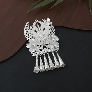 Detailed shot of traditional Chinese style Miao silver filigree DIY tassel pendant jewelry.