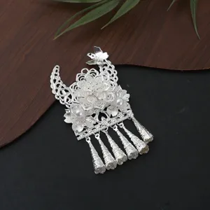 Detailed view of Chinese Miao silver filigree butterfly hair accessory featuring pearls and tassels.