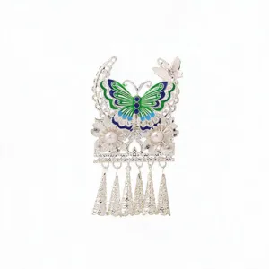 Traditional Miao style silver butterfly fridge magnet with pearl and long tassels decor.
