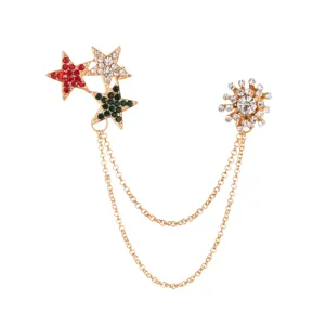 Exquisite rhinestone crystal snowflake and star chain brooch detail shot, sparkling gold finish.