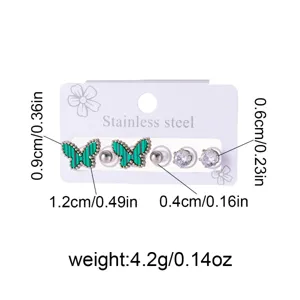 Stainless steel butterfly and rhinestone stud earrings detail, multi-piece earring set.