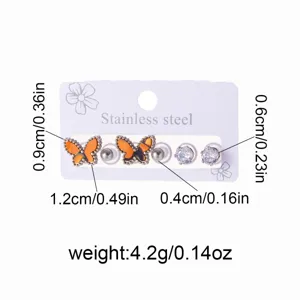 Detail view of stainless steel butterfly and crystal stud earrings set with size specs.