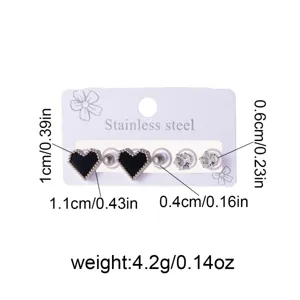 Stainless steel ear stud set featuring black heart and crystal designs for daily wear.