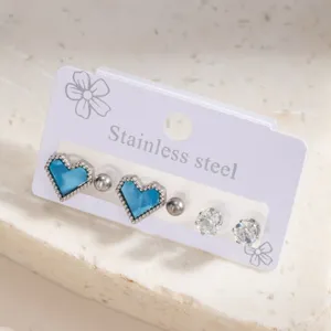 Stainless steel blue heart and crystal stud earrings detail view showing fine craftsmanship.