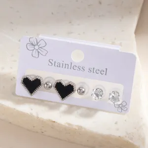 Stainless steel earring set featuring black heart and crystal studs for women fashion daily wear