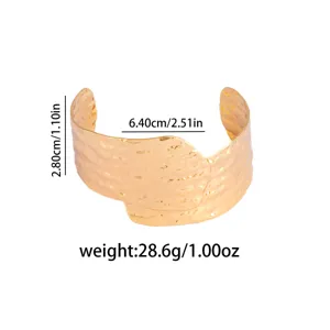 Detailed view of the wide irregular metallic open cuff bracelet, showing dimensions and premium finish.