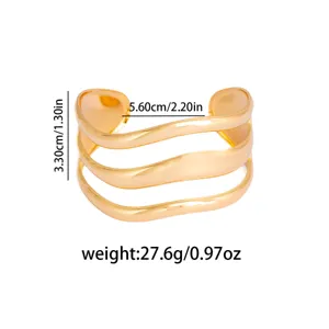 Gold multi-strand wavy cuff bracelet, statement open geometric metal hand jewelry.