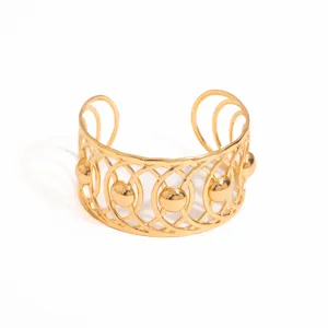 Exquisite gold open cuff bracelet with intricate geometric hollow design and chic vintage metal style.
