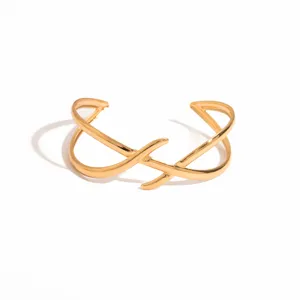 Gold geometric open bangle detail, retro irregular hollow metal bracelet design for women.
