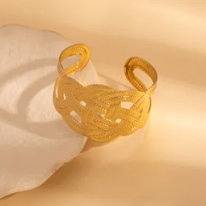 Gold-tone woven open cuff bracelet, vintage geometric hollow metal hand jewelry for women.