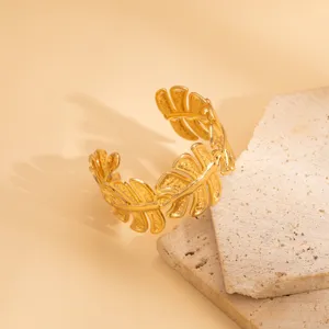 Close-up view of the retro gold irregular hollow leaf open cuff bracelet, delicate metal texture.