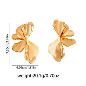 Exaggerated gold metal leaf earrings, retro statement dangle jewelry for women daily wear.