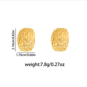 Gold textured irregular geometric metal earrings featuring retro molten studs.