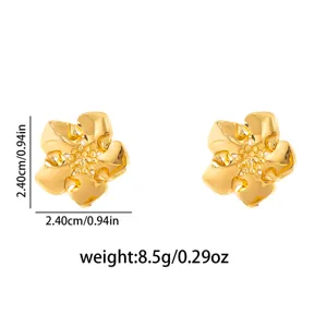 Close-up detail shot of gold flower metal stud earrings, intricate petal texture and dimension.
