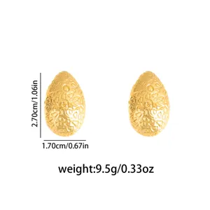 Gold textured stainless steel drop earrings with unique organic pebble design and dimensions.