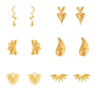 Detail shot of vintage gold earrings set, diverse geometric and floral stainless steel designs.