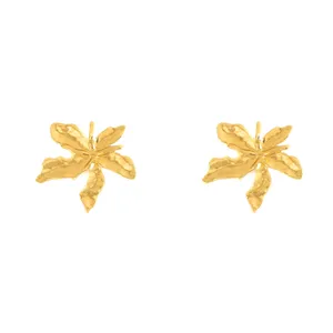Close-up detail shot of creative gold metal leaf ear studs, stylish retro jewelry accessory.