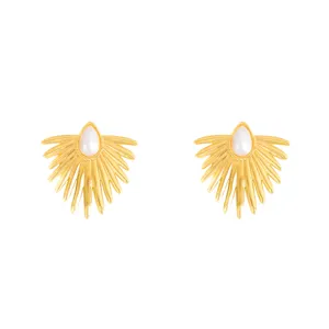Exquisite gold sunburst teardrop pearl earrings detail view, elegant metal design style.