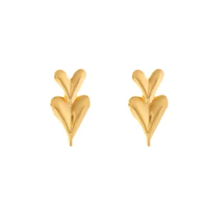 Gold double heart stud earrings detailed close up view, minimalist geometric metal jewelry design for women.