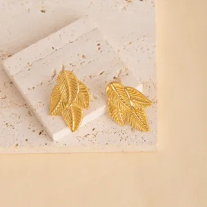 Gold leaf stud earrings metal geometric earrings vintage style jewelry detail view