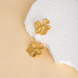 Gold flower metal stud earrings for women, vintage stainless steel chic jewelry detail shot