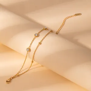 Minimalist stainless steel rhinestone double-layer bracelet with chic metal beads & charms.