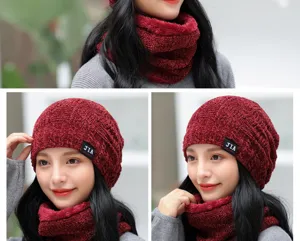 Close-up detail of cozy knit winter beanie hat and matching warm fleece lined snood scarf.