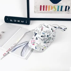 Stylish white baseball cap with trendy graffiti prints and extra long straps for streetwear.