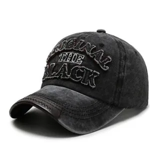 Vintage washed black baseball cap with embroidered front letters, classic curved brim casual hat.
