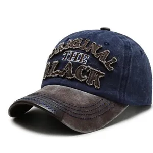 Vintage washed denim baseball cap featuring retro letter embroidery and curved brim.