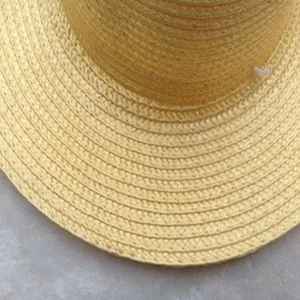 Classic woven straw sun hat with wide brim, perfect for outdoor farming and summer beach wear.