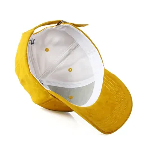 Yellow suede baseball cap interior detail, adjustable metal buckle and breathable white lining.